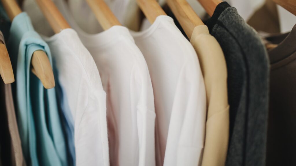 Organised Clothes On Hangers In A Wardrobe